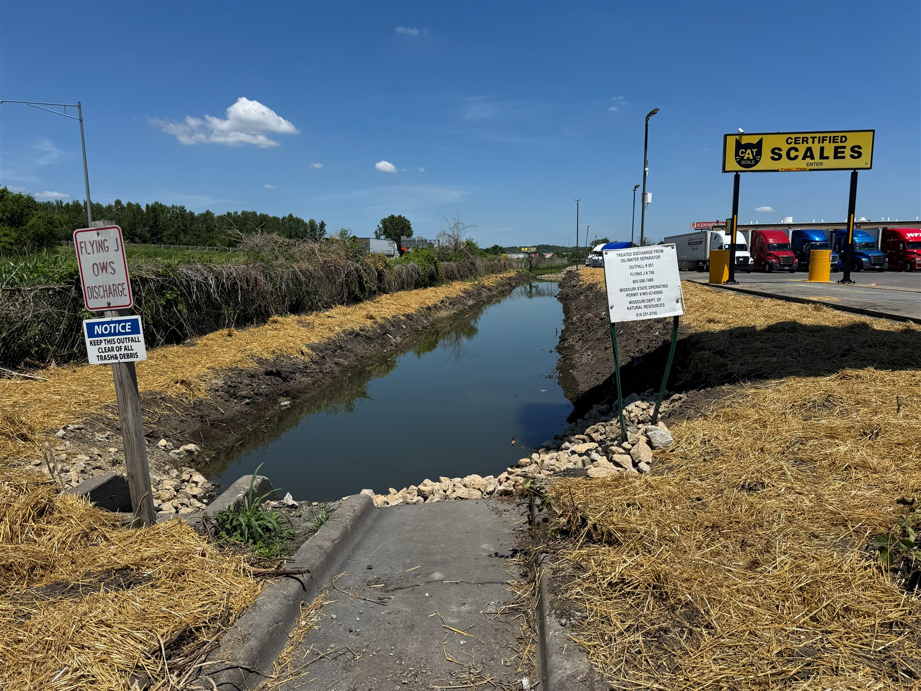 Restored stormwater channel with riprap and stabilized banks